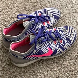 Pink and purple Nike running shoes